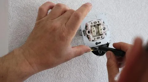 Installing and fixing the room switch close-up Stock Photos