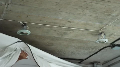 Installing and maintenance stretch ceiling in new flat Stock Footage 251385063