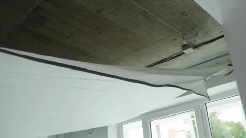 Installing and maintenance stretch ceiling in new flat Stock Footage 254131083