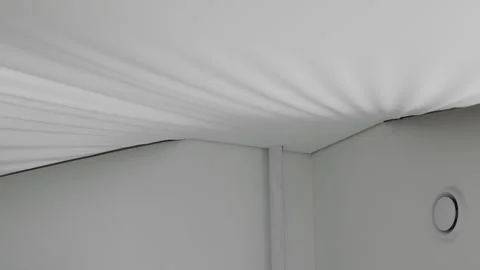 Installing and maintenance stretch ceiling in new flat Stock Footage 254131128