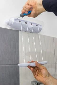 Installing bathroom accessories 2 Stock Photos