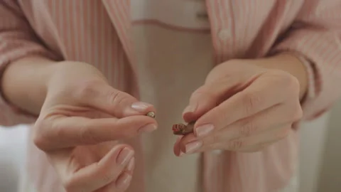 Installing battery for hearing aid Stock Footage 85567459