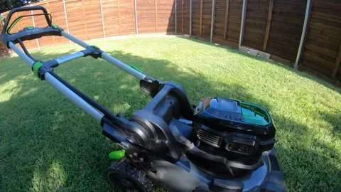 Installing battery in mower Stock Footage 112680173