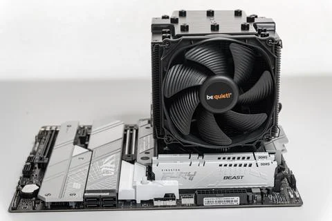 Installing a be quiet CPU cooler Dark Rock Pro 4 on the motherboard. Stock Photos