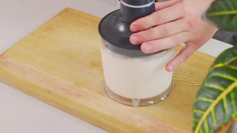 Installing the blender motor unit into a bowl filled with ingredients 스톡 동영상 312720442