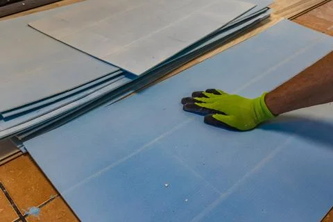 Installing Blue Foam Underlay for Vinyl or Laminate Flooring Home Renovation Stock Photos
