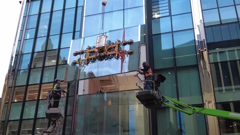 Installing building glass window Stock Footage 336695664