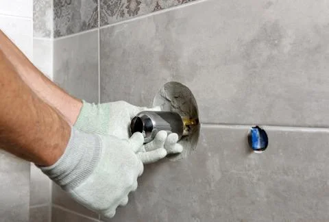 Installing the built-in faucet. Stock Photos