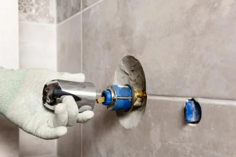 Installing the built-in faucet. Stock Photos