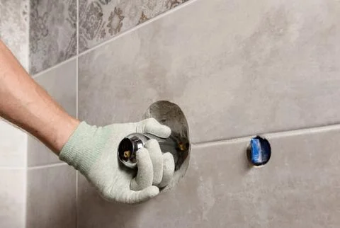 Installing the built-in faucet. Stock Photos