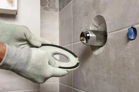 Installing the built-in faucet. Stock Photos