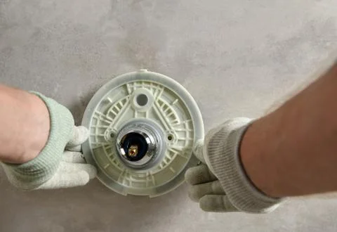 Installing the built-in faucet. Stock Photos