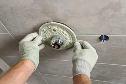 Installing the built-in faucet. Stock Photos