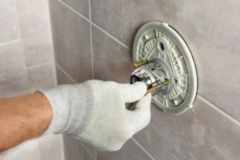 Installing the built-in faucet. Stock Photos