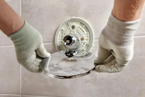 Installing the built-in faucet. Stock Photos
