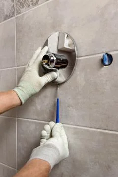 Installing the built-in faucet. Stock Photos