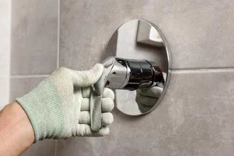 Installing the built-in faucet. Stock Photos