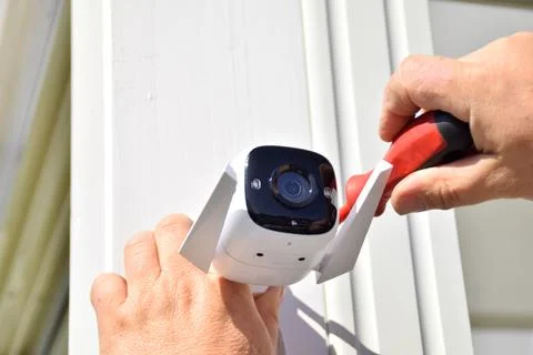 Installing a CCTV camera Stock Photos