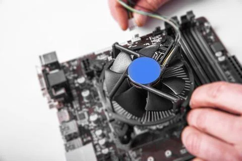 Installing central processor unit into computer motherboard. 写真素材