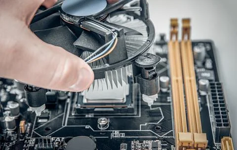 Installing central processor unit into computer motherboard. Stock Photos