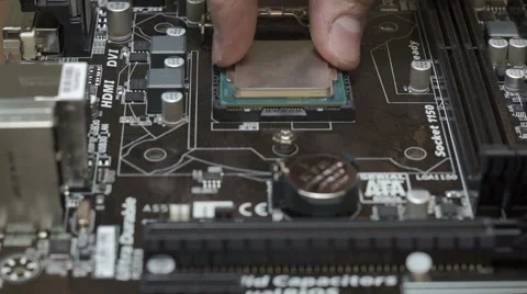 Installing central processor unit into motherboard Stock Footage 46812900