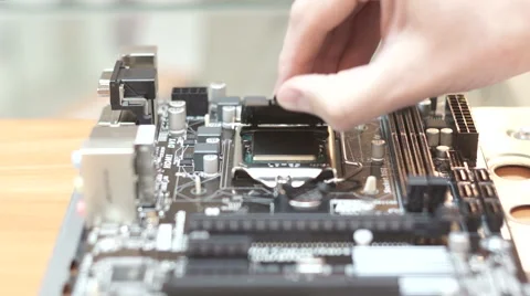 Installing central processor unit into motherboard Stock Footage 46850988