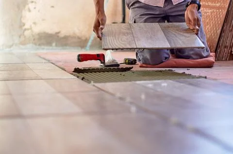 Installing ceramic floor Stock Photos