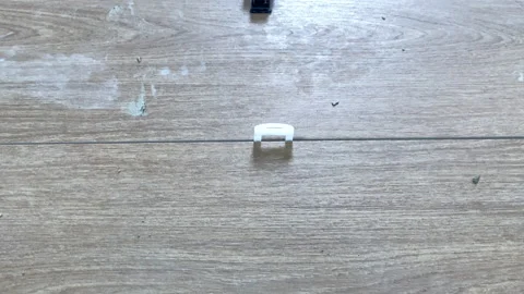 Installing ceramic floor tiles. Stock Footage 153538002