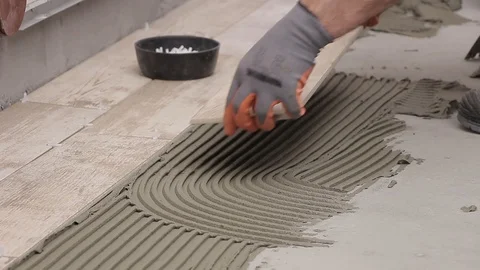Installing ceramic tiles with cement adhesive Stock Footage 111865275