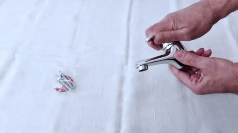 Installing a Chrome Bathroom Faucet with Wall Mount Accessories 스톡 동영상 311795493