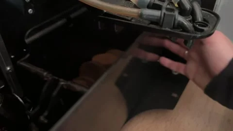 Installing coffee grounds container in automatic coffee machine Stock Footage 336977023