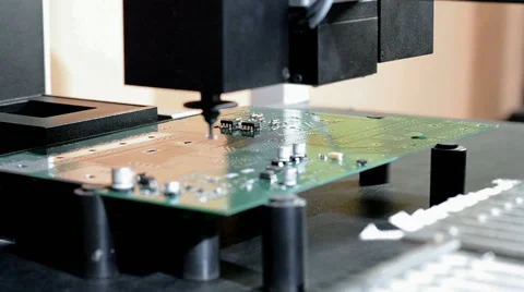 Installing components on a circuit Board with a robot manipulator Timelapse Stock Footage 48842980