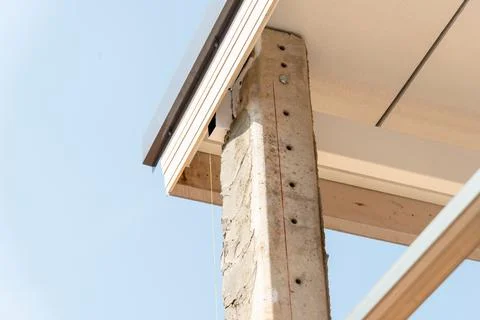 Installing concrete pillars in urban construction a sunny day perspective 写真素材
