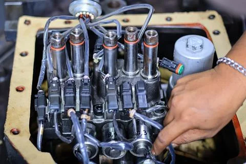 Installing Control Valve Automatic Transmission in workshop services Stock Photos