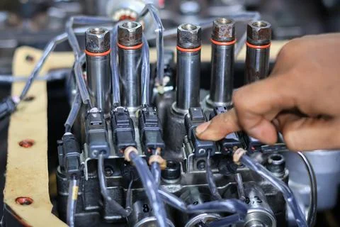 Installing Control Valve Automatic Transmission in workshop services Stock Photos