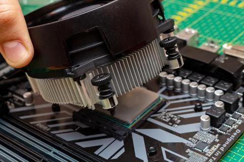 Installing a cooler on a personal computer processor. The process of upgradin 스톡 사진