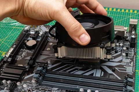 Installing a cooler on a personal computer processor. The process of upgradin Foto stock