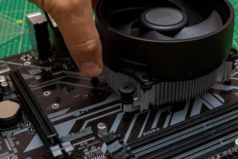 Installing a cooler on a personal computer processor. The process of upgradin 스톡 사진