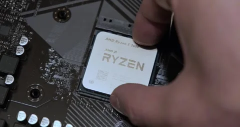 Installing CPU AMD Ryzen in AM4 socket on motherboard Stock Footage 304447717