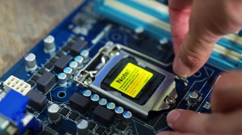 Installing CPU processor unit to motherboard Stock Footage 45892994