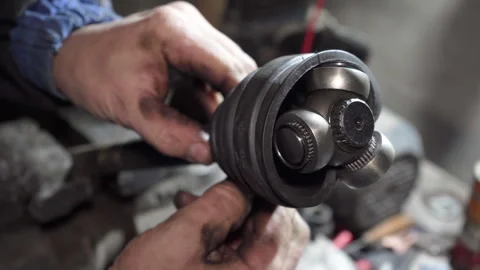 Installing a CV joint dust cover Stock Footage 328143394