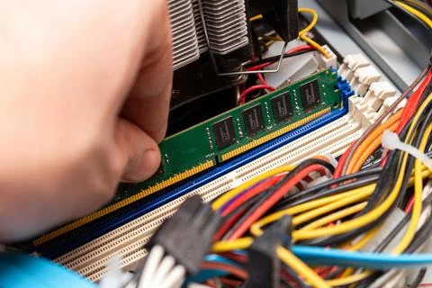 Installing ddr dimm memory, assembling personal computer in a service, hand u Stock Photos