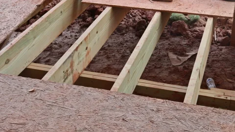Installing deck boards with above ground deck, patio construction. Stock Footage 155704959