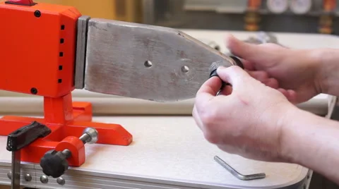 Installing die head on welding machine 01 Stock Footage 60232656