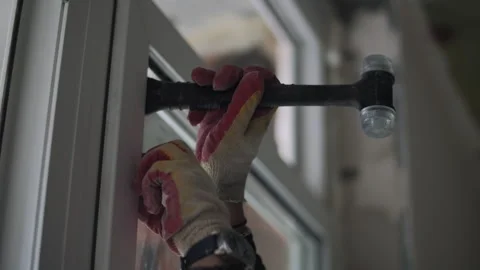 Installing double glazed window unit with rubber mallet Stock Footage 327290273