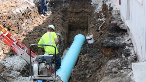 Installing Drain Pipe Stock Footage 104758314