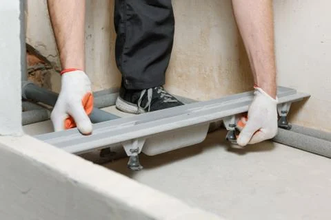 Installing a drain in the shower box. Stock Photos