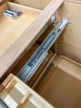 Installing Drawer Glide Inside Wooden Cabinet Stock Photos