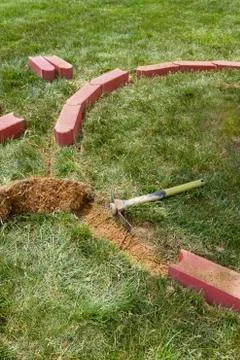 Installing edging bricks Stock Photos