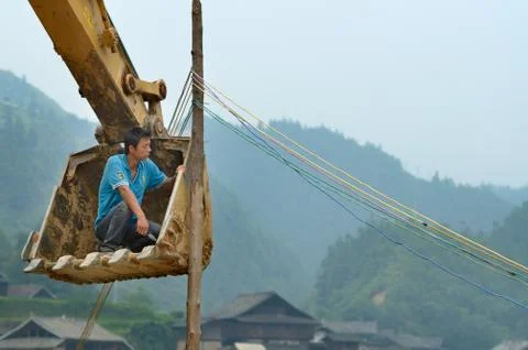 Installing electrical cables in China Stock Photos